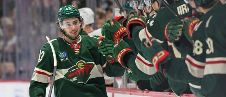Minnesota Wild defensemen Quinn Hughes (43) celebrates after scoring a goal against the Boston Bruins during the third period at Grand Casino Arena.