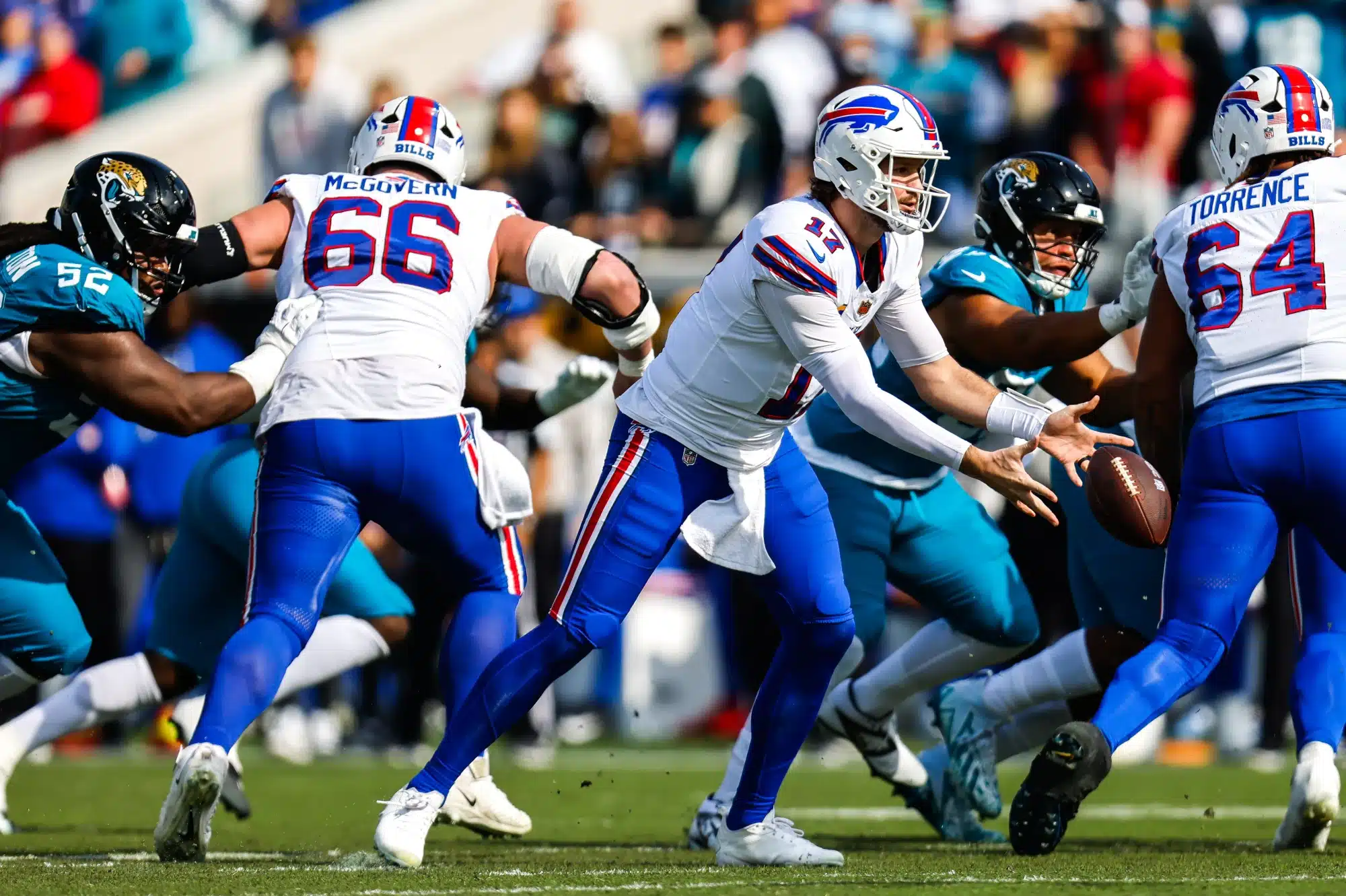 Buffalo Bills quarterback Josh Allen (17) tosses the ball during the first quarter in an NFL football AFC Wild Card playoff matchup, Sunday, Jan. 11, 2026, in Jacksonville, Fla. Bills lead 10-7 at the half over the Jaguars.