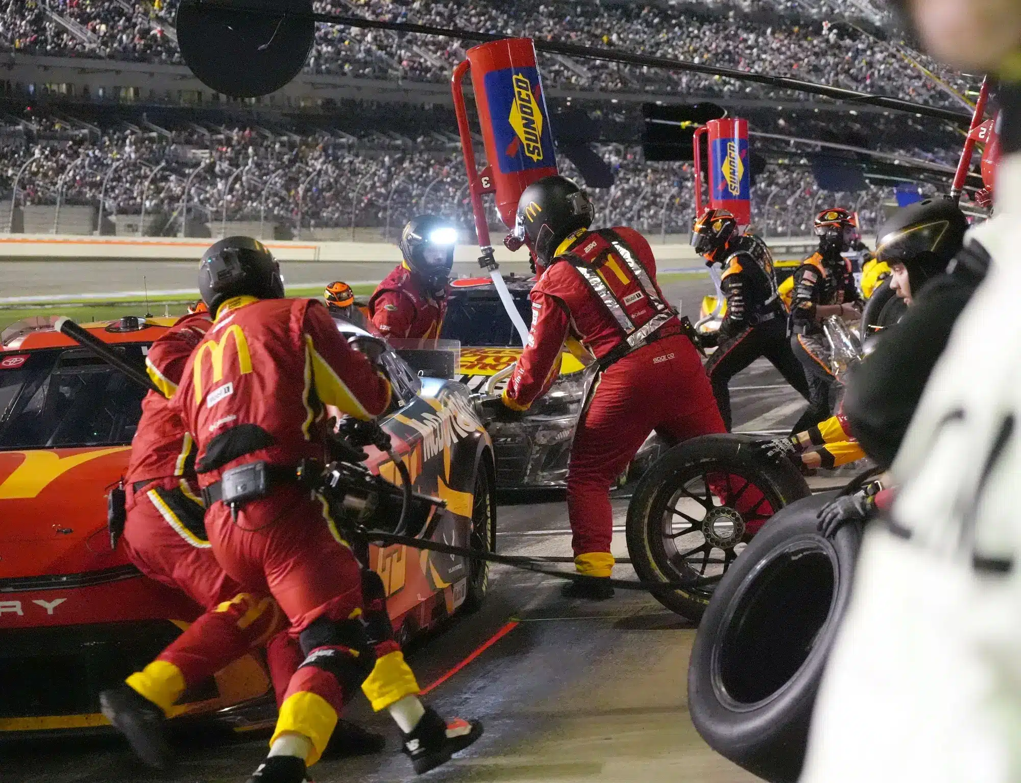 Pit crews go to work,, Sunday February 16, 2025 during the Daytona 500 at Daytona International Speedway.