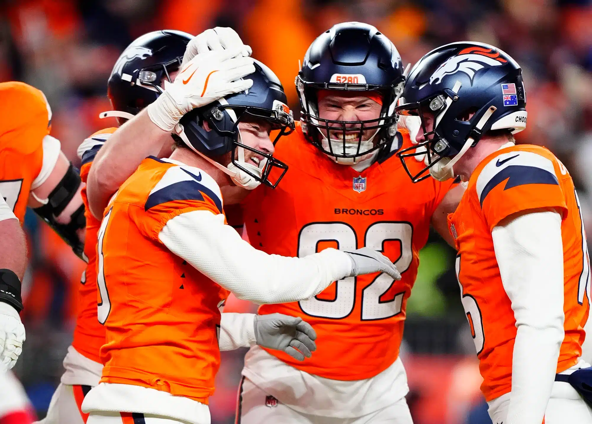 Jan 17, 2026; Denver, CO, USA; Denver Broncos place kicker Wil Lutz (3) celebrates with tight end Adam Trautman (82) and punter Jeremy Crawshaw (16) after kicking a game-winning field goal during overtime of an AFC Divisional Round playoff game against the Buffalo Bills at Empower Field at Mile High.