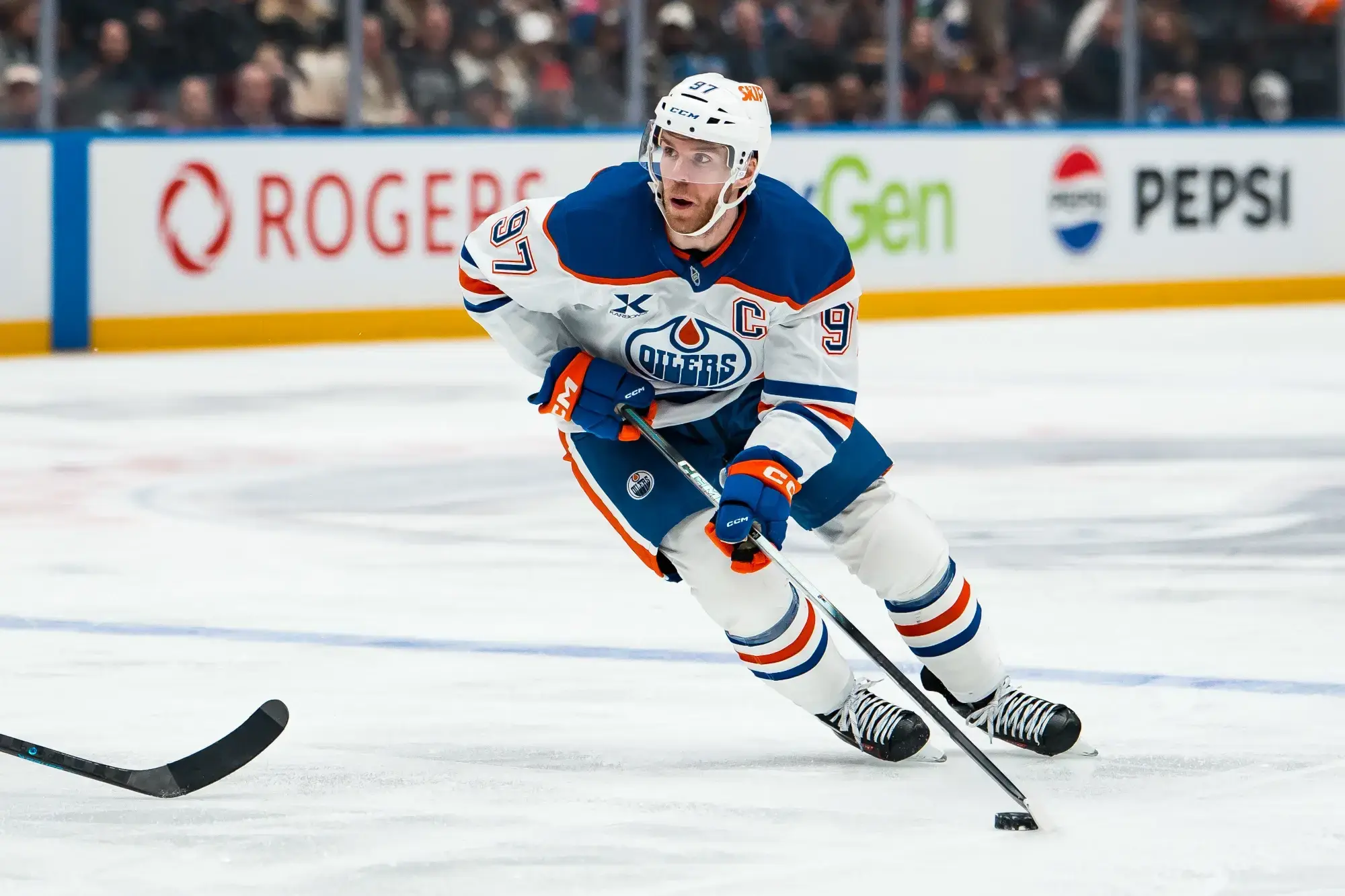 Jan 17, 2026; Vancouver, British Columbia, CAN; Edmonton Oilers forward Connor McDavid (97) handles the puck against the Vancouver Canucks in the third period at Rogers Arena.