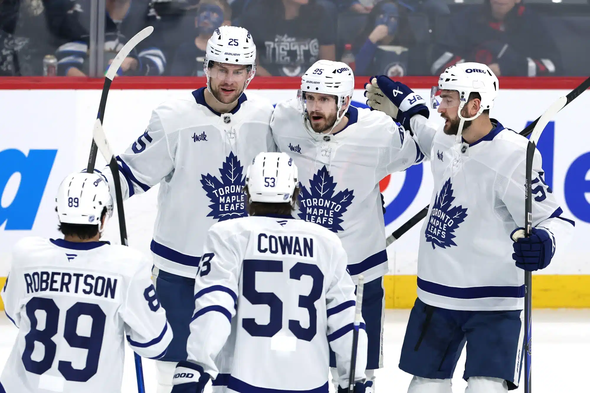 Jan 17, 2026; Winnipeg, Manitoba, CAN; Toronto Maple Leafs defenseman Oliver Ekman-Larsson (95) celebrates a goal against the Winnipeg Jets in the third period at Canada Life Centre.