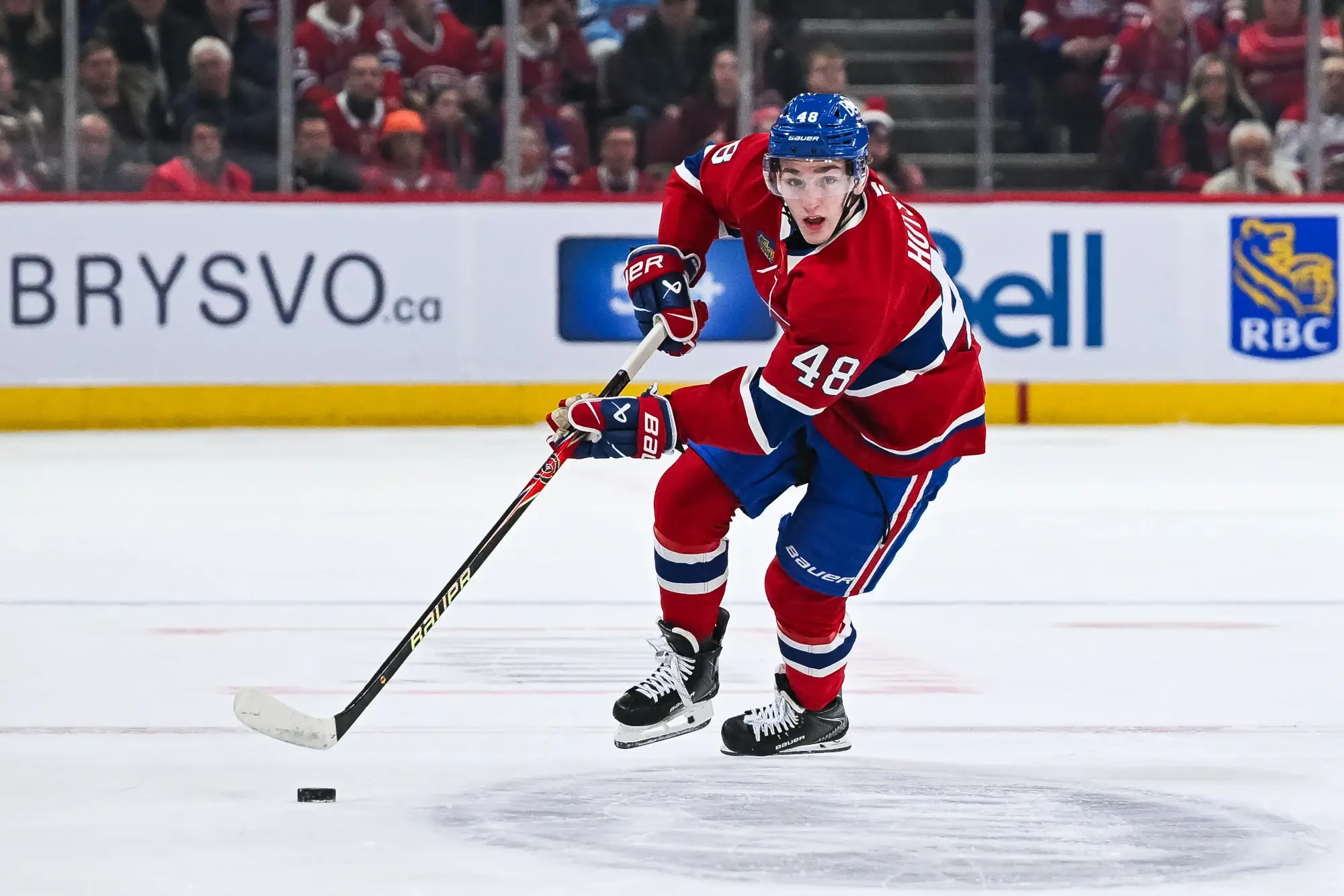 Jan 10, 2026; Montreal, Quebec, CAN; Montreal Canadiens defenseman Lane Hutson (48) plays the puck against the Detroit Red Wings during the first period at Bell Centre.