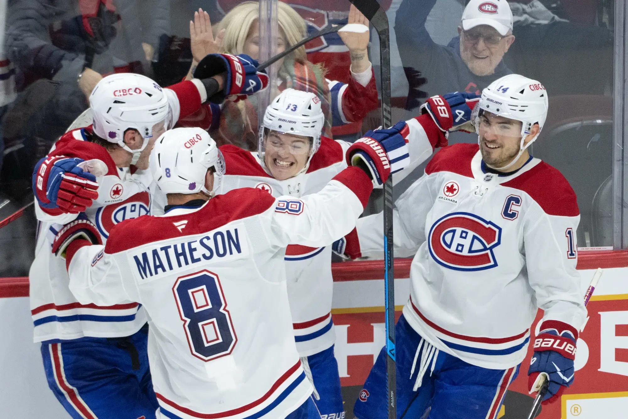 Jan 17, 2026; Ottawa, Ontario, CAN; Montreal Canadiens right wing Cole Caufield (13) celebrates with teammates after scoring the game winning overtime goal against the Ottawa Senators at the Canadian Tire Centre.