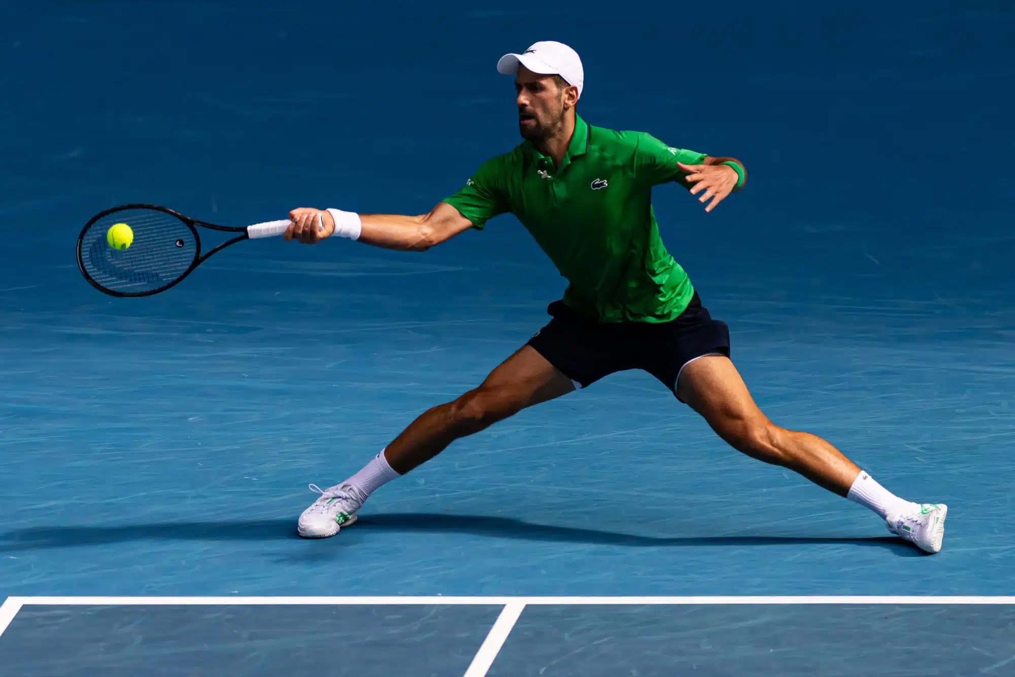 Jan 28, 2026; Melbourne, Victoria, Australia; Novak Djokovic of Serbia in action against Lorenzo Musetti of Italy in the quarterfinals of the menís singles at the Australian Open at Rod Laver Arena in Melbourne Park. 