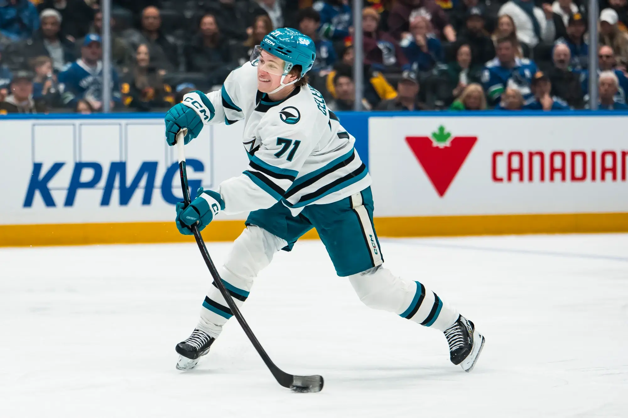 Jan 27, 2026; Vancouver, British Columbia, CAN; San Jose Sharks forward Macklin Celebrini (71) shoots against the Vancouver Canucks in the third period at Rogers Arena.