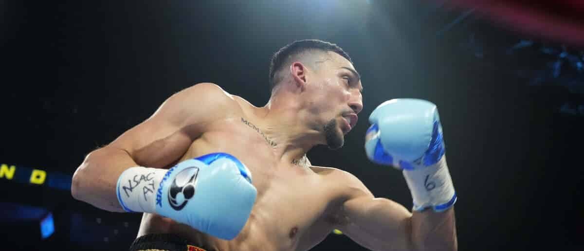 Feb 8, 2024; Las Vegas, Nevada, USA; Teofimo Lopez (black/gold/red trunks) and Jamaine Ortiz (black trunks) box during their WBO Junior Welterweight World Title bout at Michelob ULTRA Arena. Mandatory Credit: Joe Camporeale-USA TODAY Sports