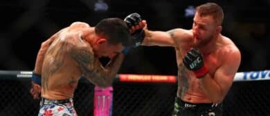 USA; Max Holloway (blue gloves) fights Justin Gaethje (red gloves) during UFC 300 at T-Mobile Arena