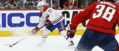 Montreal Canadiens right wing Cole Caufield (13) prepares to shoot the puck as Washington Capitals defenseman Rasmus Sandin (38) looks on in the second period in game five of the first round of the 2025 Stanley Cup Playoffs at Capital One Arena.