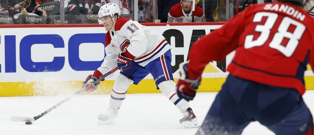Montreal Canadiens right wing Cole Caufield (13) prepares to shoot the puck as Washington Capitals defenseman Rasmus Sandin (38) looks on in the second period in game five of the first round of the 2025 Stanley Cup Playoffs at Capital One Arena.