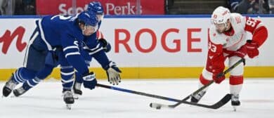 Toronto Maple Leafs defenceman Simon Benoit (2) and center Bobby McMann (74) defend against Detroit Red Wings right wing Alex DeBrincat (93) in the second period at Scotiabank Arena