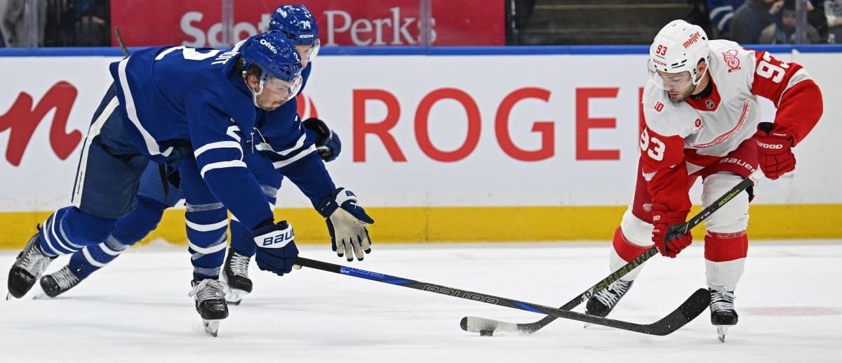 Toronto Maple Leafs defenceman Simon Benoit (2) and center Bobby McMann (74) defend against Detroit Red Wings right wing Alex DeBrincat (93) in the second period at Scotiabank Arena