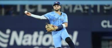 Toronto Blue Jays designated hitter Bo Bichette (11) throws out Los Angeles Dodgers shortstop Mookie Betts (50) in the sixth inning during game six of the 2025 MLB World Series at Rogers Centre.