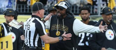 Pittsburgh Steelers head coach Mike Tomlin (right) reacts to down judge Danny Short (113) against the Indianapolis Colts during the fourth quarter at Acrisure Stadium.