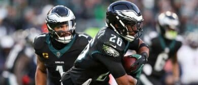 Philadelphia Eagles quarterback Jalen Hurts (1) hands the ball to Philadelphia Eagles running back Saquon Barkley (26) against the Chicago Bears during the second quarter of the game at Lincoln Financial Field