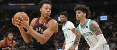 Toronto Raptors guard Scottie Barnes (4) looks for a play as Charlotte Hornets guard LaMelo Ball (1) defends during the first half at Scotiabank Arena