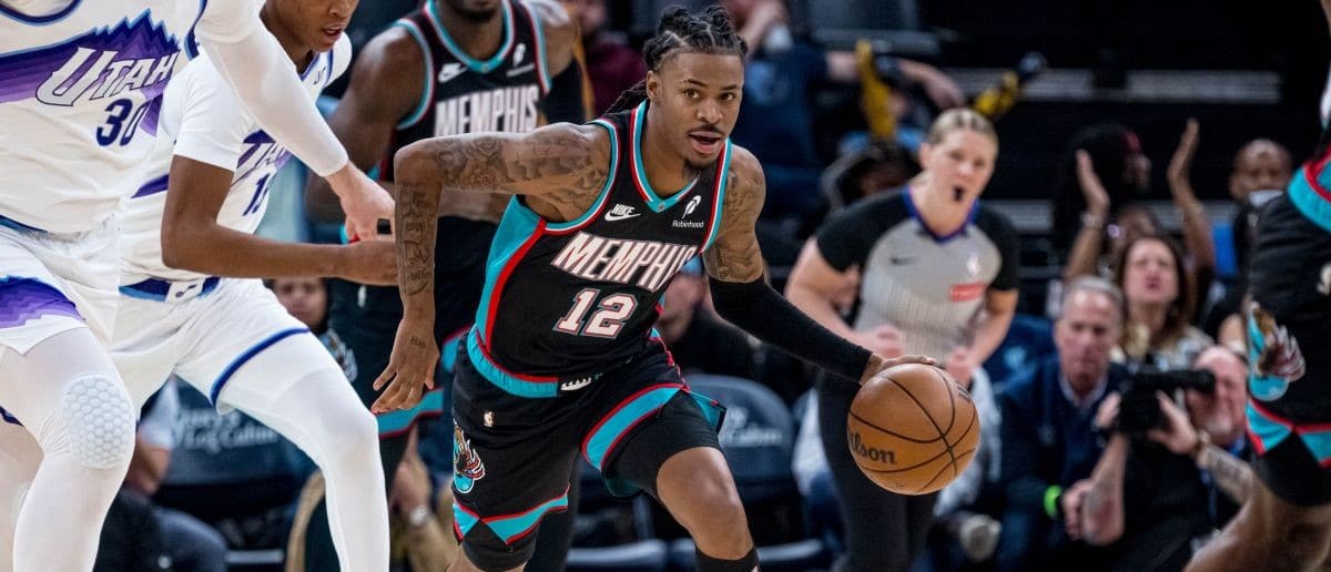 Memphis Grizzlies point guard Ja Morant (12) drives down the court in the first quarter against the Utah Jazz at FedExForum