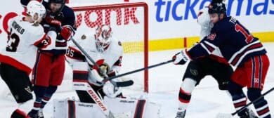 Winnipeg Jets forward Jonathan Toews (19) tries to deflect the puck past Ottawa Senators goalie Linus Ullmark (35) during the third period at Canada Life Centre.