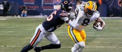 Green Bay Packers running back Josh Jacobs (8) runs with the ball against Chicago Bears cornerback Nahshon Wright (26) during the first quarter at Soldier Field