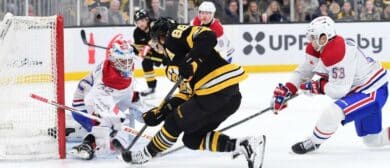 Montreal Canadians goaltender Jacob Fowler (32) makes a save on Boston Bruins right wing David Pastrnak (88) while defenseman Noah Dobson (53) defense during the first period at TD Garden