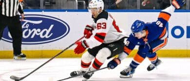New Jersey Devils left wing Jesper Bratt (63) makes a move around New York Islanders defenseman Matthew Schaefer (48) during the third period at UBS Arena