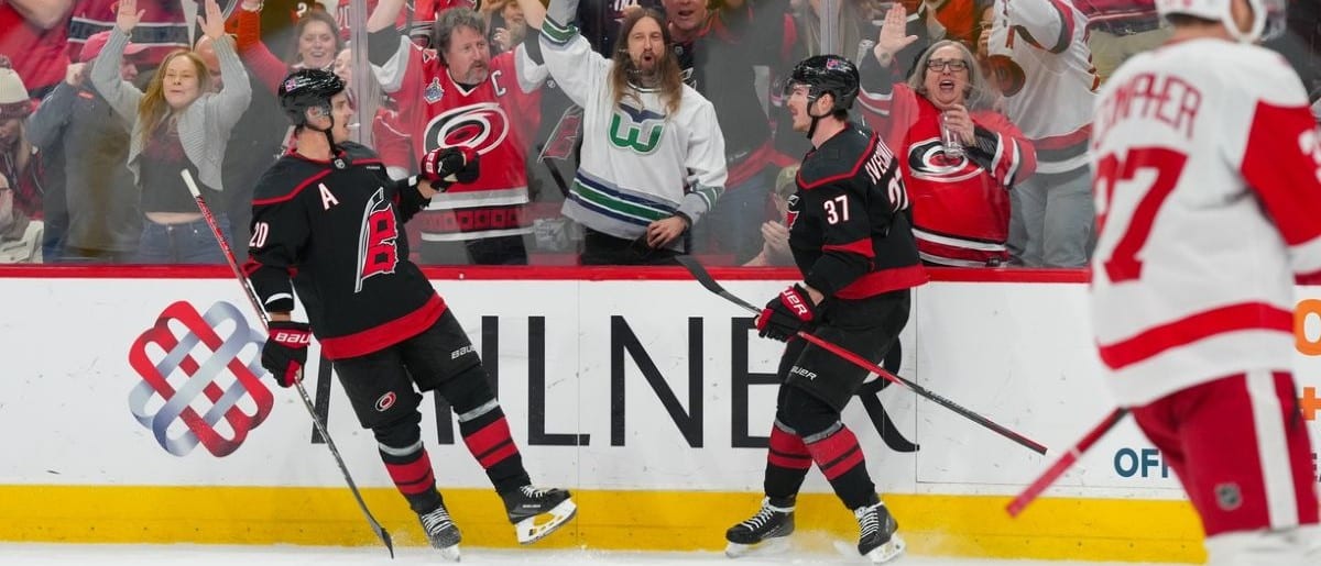 Carolina Hurricanes right wing Andrei Svechnikov (37) is congratulated by center Sebastian Aho (20) after his goal against the Detroit Red Wings during the third period at Lenovo Center