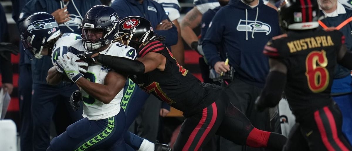 Seattle Seahawks running back Kenneth Walker III (9) rushes the ball against San Francisco 49ers safety Ji'ayir Brown (27) during the first half at Levi's Stadium