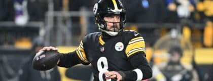 Pittsburgh Steelers quarterback Aaron Rodgers (8) drops back to pass against the Baltimore Ravens during the first half at Acrisure Stadium