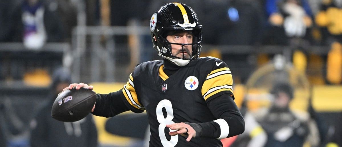 Pittsburgh Steelers quarterback Aaron Rodgers (8) drops back to pass against the Baltimore Ravens during the first half at Acrisure Stadium