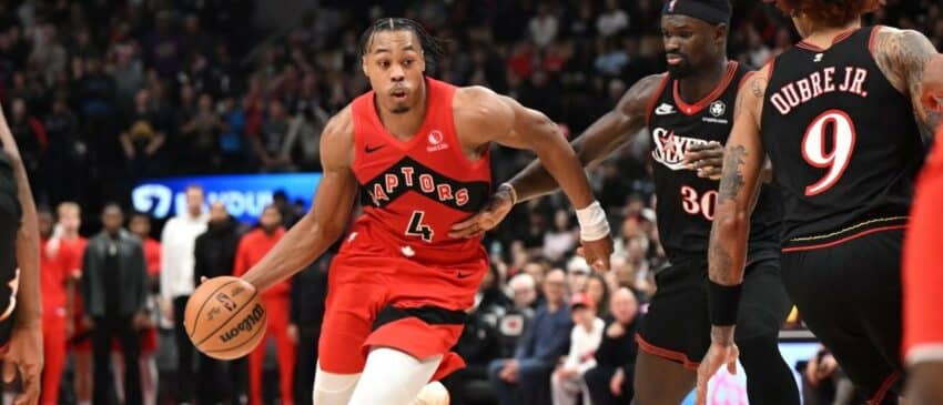 Toronto Raptors forward Scottie Barnes (4) dribbles the ball past Philadelphis 76ers center Adam Bona (30) in the second half at Scotiabank Arena