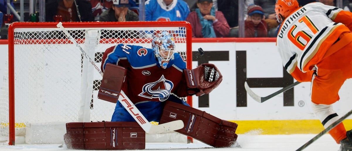 Colorado Avalanche goaltender Scott Wedgewood (41) deflects a shot from Anaheim Ducks left wing Cutter Gauthier (61) in overtime at Ball Arena.