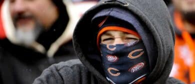 Chicago Bears fans bundles up in the cold weather during their game against the Detroit Lions at Soldier Field