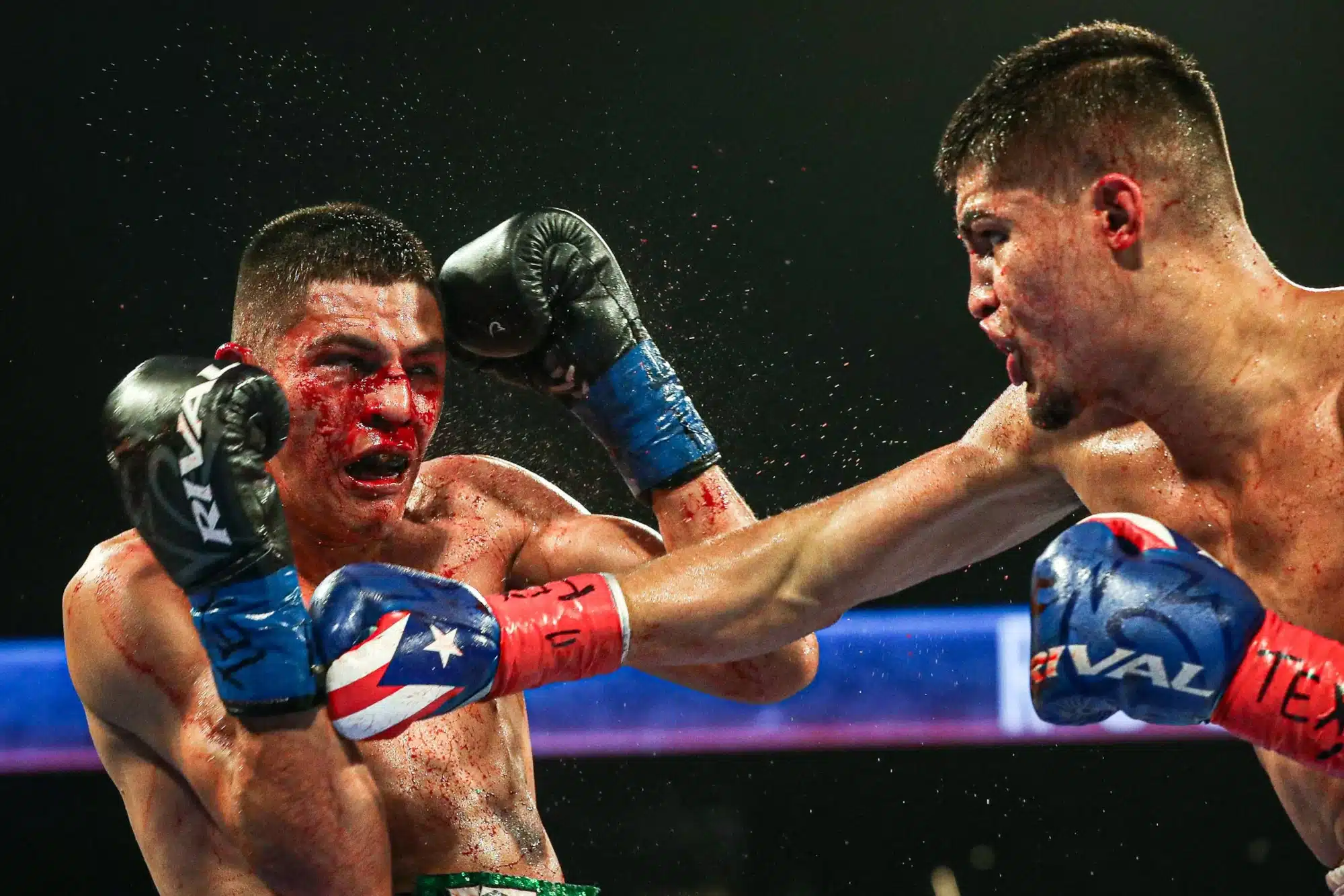 Xander Zayas, right, pummels Roberto Valenzuela, Jr.'s broken nose during a fight for the NABO/ NABF Junior Middleweight Titles live on ESPN during a Top Rank bout at the American Bank Center on Friday, Sept. 15, 2023, in Corpus Christi, Texas. Zayas won by technical knockout in the fifth round.