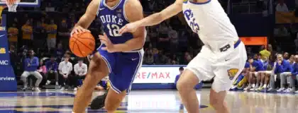 Feb 10, 2026; Pittsburgh, Pennsylvania, USA; Duke Blue Devils forward Cameron Boozer (12) dribbles the ball as Pittsburgh Panthers guard Nojus Indrusaitis (right) defends during the second half at Petersen Events Center.