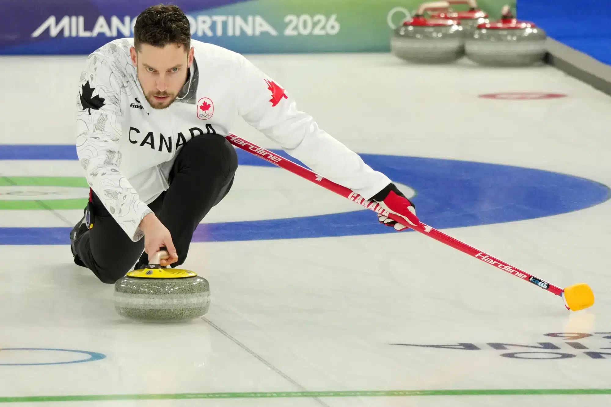 Feb 9, 2026; Cortina d'Ampezzo, Italy; Brett Gallant of Team Canada during a curling mixed doubles match during the Milano Cortina 2026 Olympic Winter Games at Cortina Curling Olympic Stadium. 