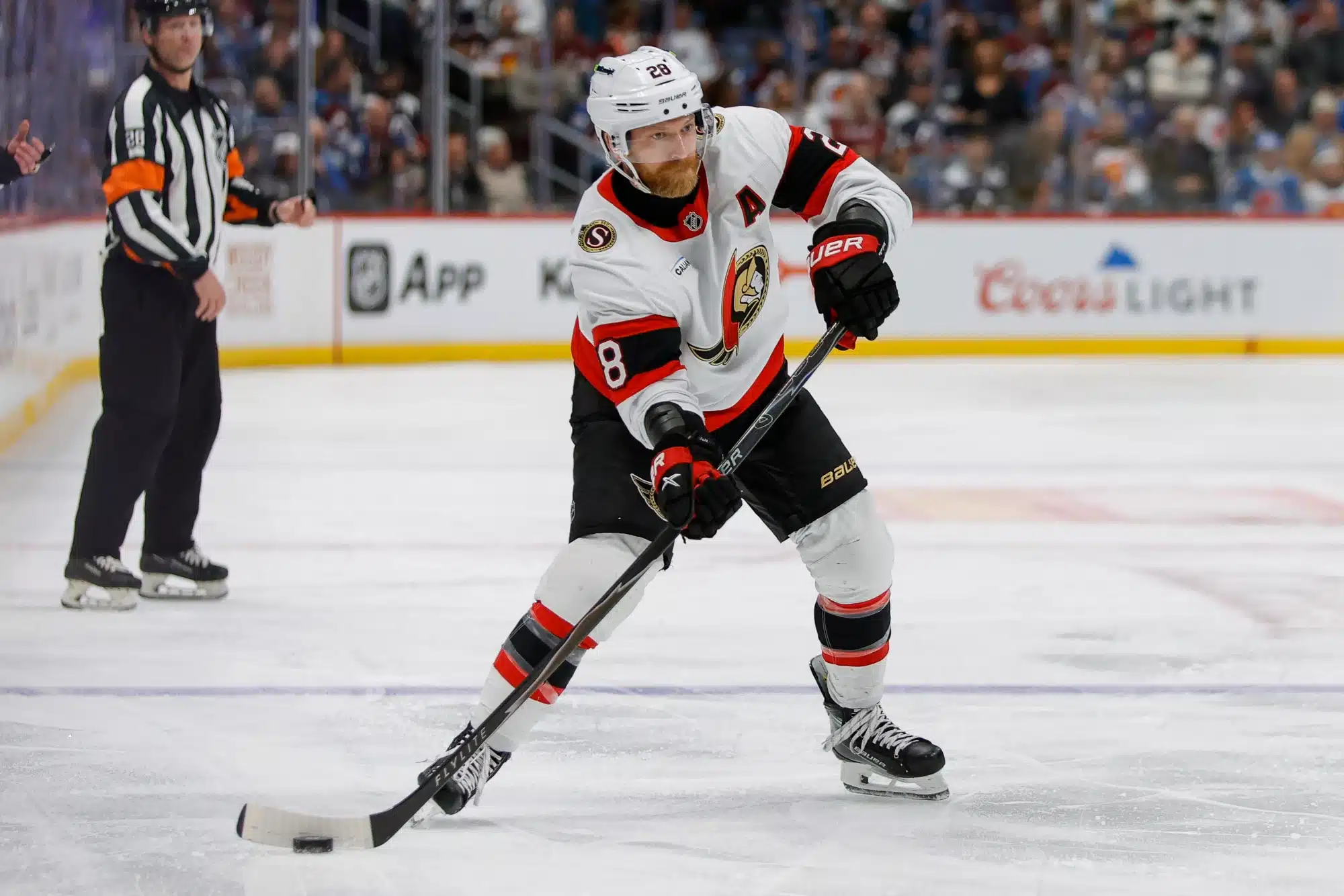 Jan 8, 2026; Denver, Colorado, USA; Ottawa Senators right wing Claude Giroux (28) controls the puck in the third period against the Colorado Avalanche at Ball Arena.