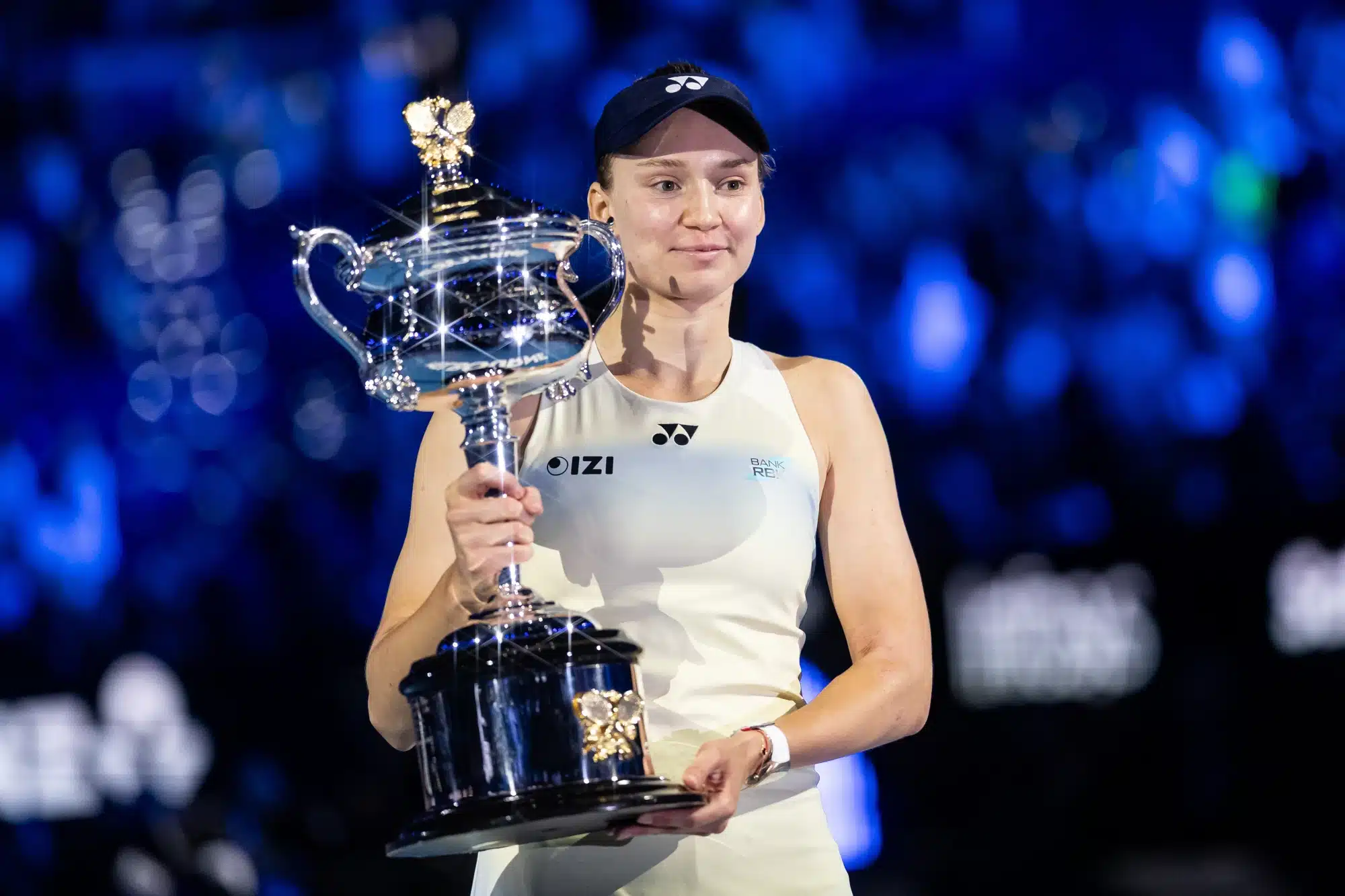 Jan 31, 2026; Melbourne, Victoria, Australia; Elena Rybakina of Kazakhstan with the Daphne Akhurst Memorial Cup after her victory over Aryna Sabalenka in the final of the womenรญs singles at the Australian Open at Rod Laver Arena in Melbourne Park.