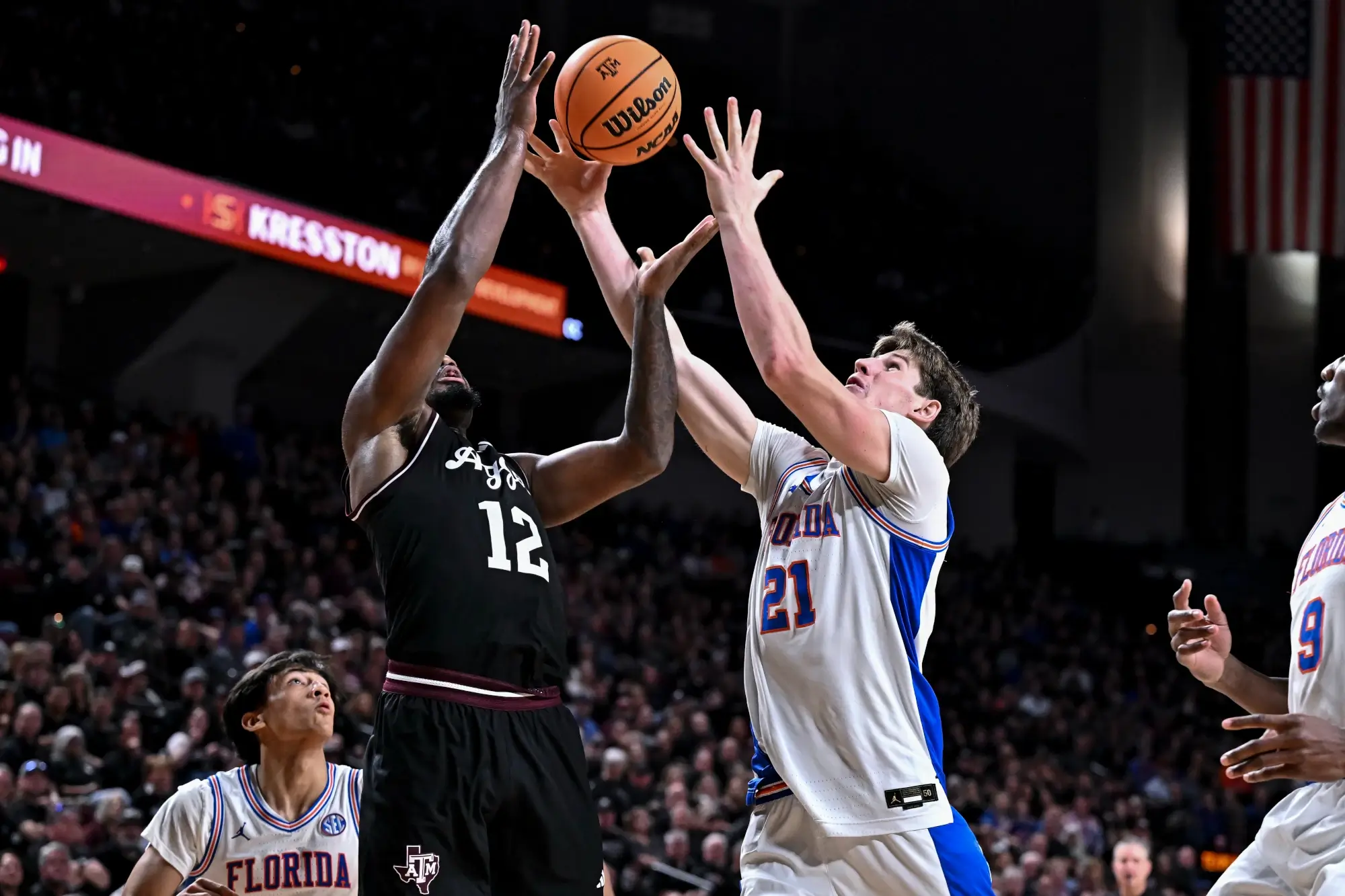 Feb 7, 2026; College Station, Texas, USA; Florida Gators forward Alex Condon (21) and Texas A&M Aggies forward Rashaun Agee (12) go for the rebound during the second half at Reed Arena.