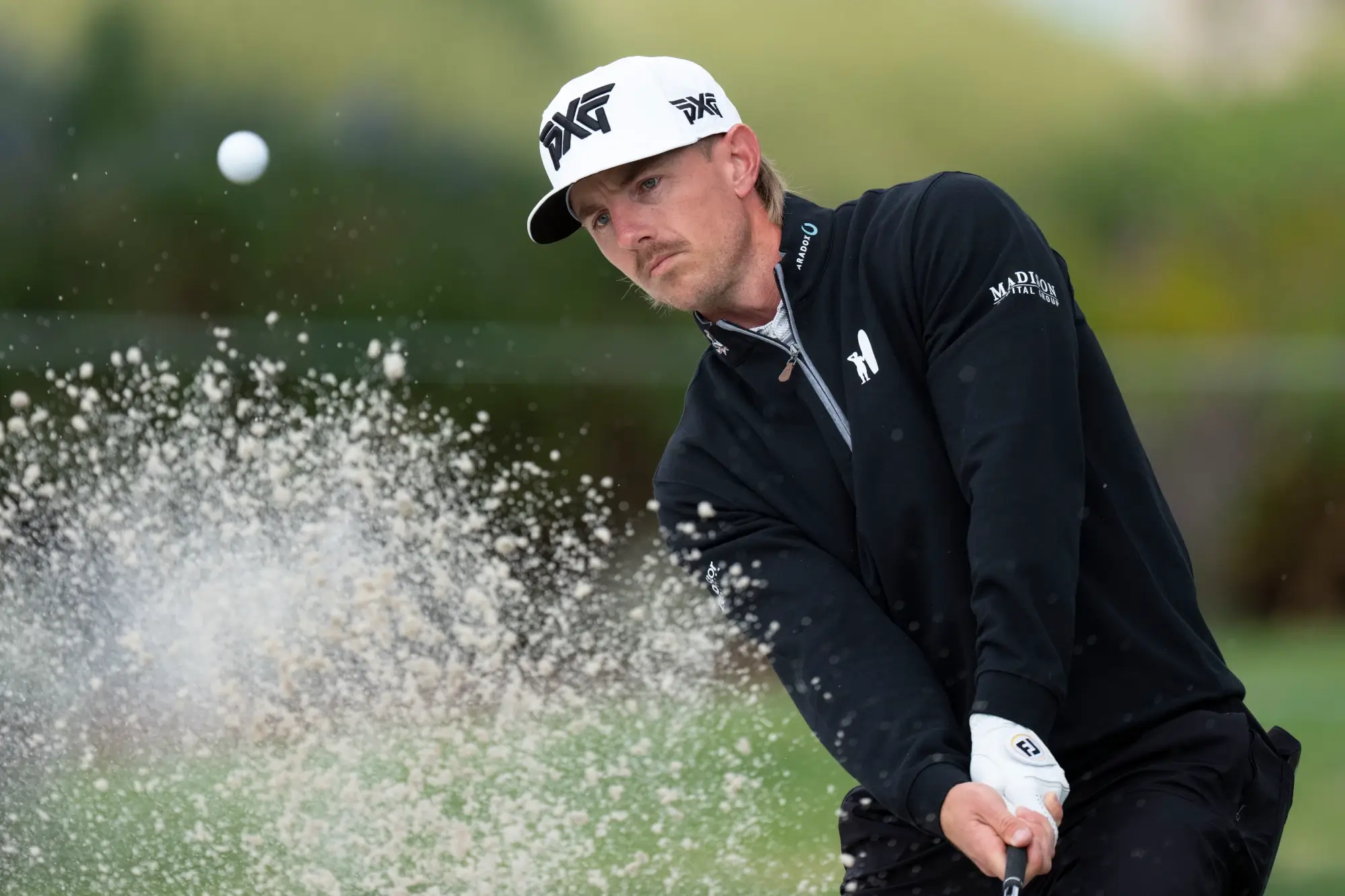 February 15, 2026; Pebble Beach, California, USA; Jake Knapp hits his bunker shot on the second hole during the final round of a golf tournament at Pebble Beach Golf Links. 
