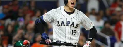 Mar 20, 2023; Miami, Florida, USA; Japan designated hitter Shohei Ohtani (16) reacts on his way to first base after a walk in the seventh inning against Mexico at LoanDepot Park.