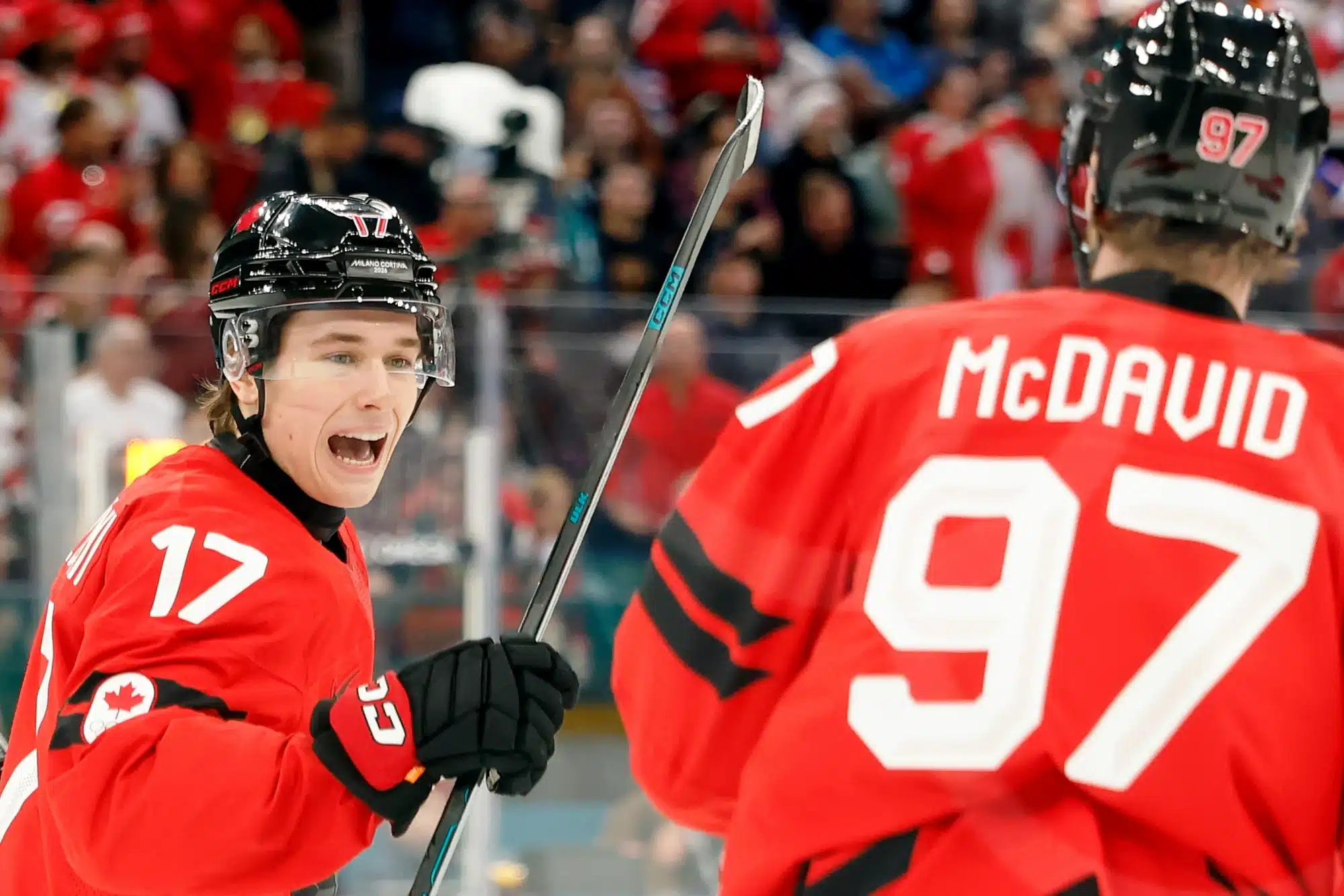 Feb 18, 2026; Milan, Italy; Macklin Celebrini of Canada celebrates with Connor McDavid after scoring their first goal against Czechia in a men's ice hockey quarterfinal during the Milano Cortina 2026 Olympic Winter Games at Milano Santagiulia Ice Hockey Arena. 