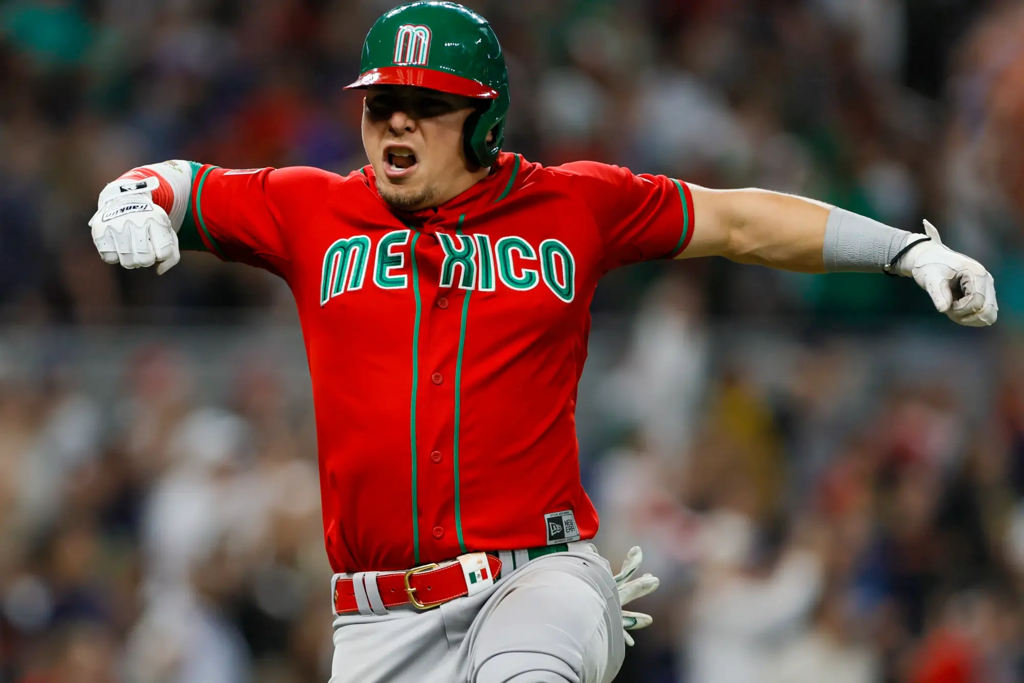 Mar 20, 2023; Miami, Florida, USA; Mexico second baseman Luis Urias (3) celebrates after hitting a two-run home run during the fourth inning against Japan at LoanDepot Park. 