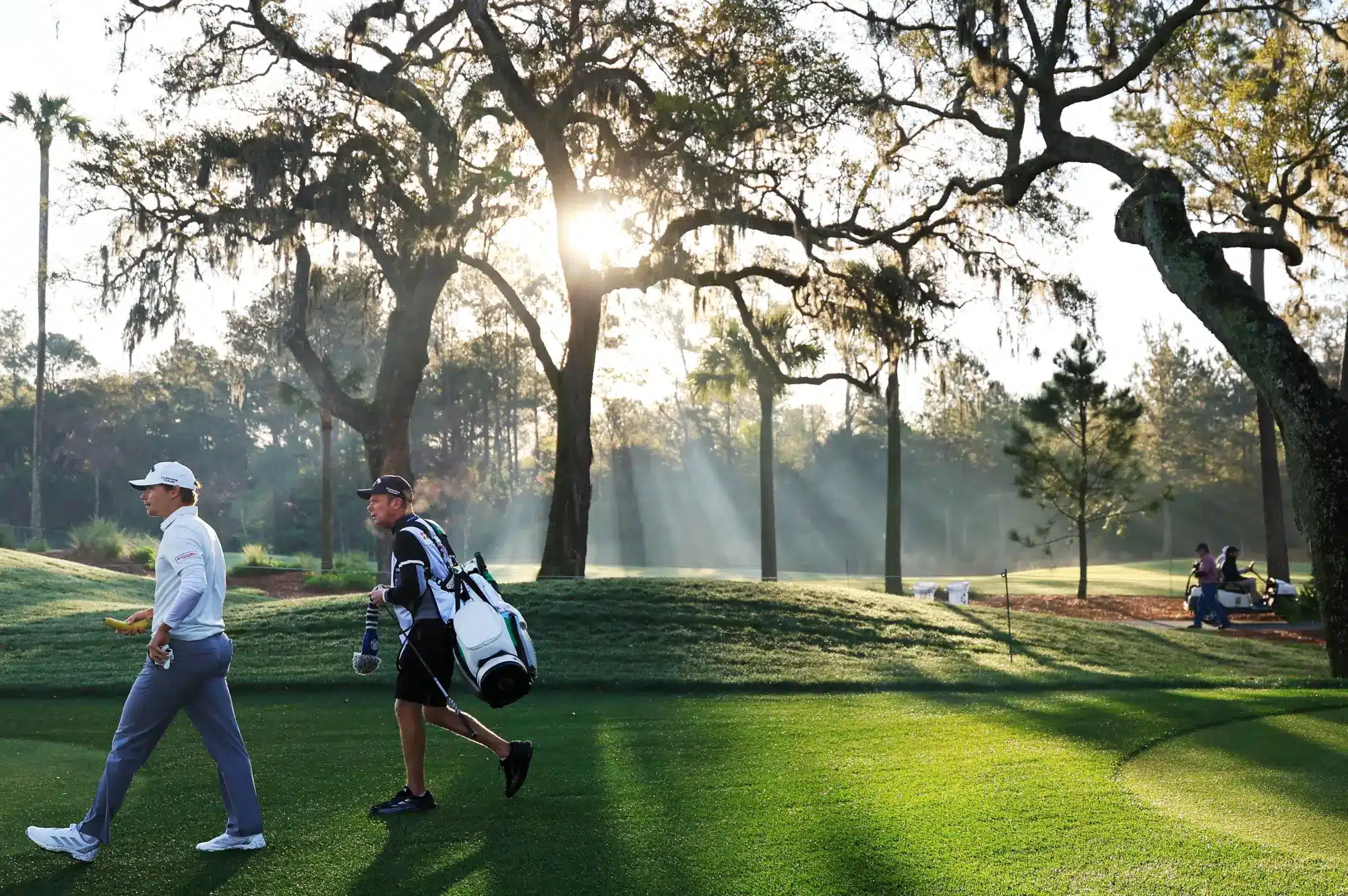  Nicolai Højgaard, left, and caddie Christian Christensen walk down the 12th fairway during the first round of The Players Championship PGA golf tournment Thursday, March 13, 2025 at TPC Sawgrass in Ponte Vedra Beach, Fla.