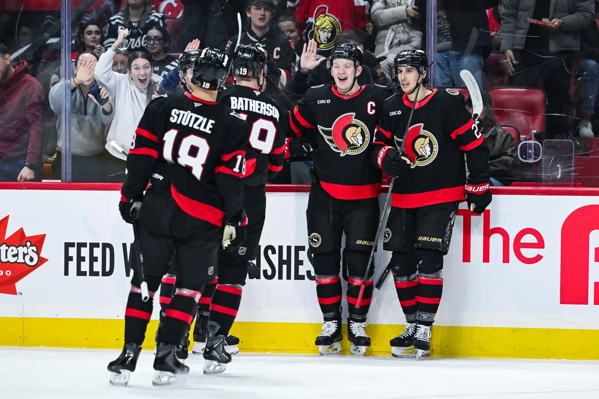 Jan 31, 2026; Ottawa, Ontario, CAN; Ottawa Senators left wing Brady Tkachuk (7) celebrates with his teammates his goal against the New Jersey Devils during the first period at Canadian Tire Centre.