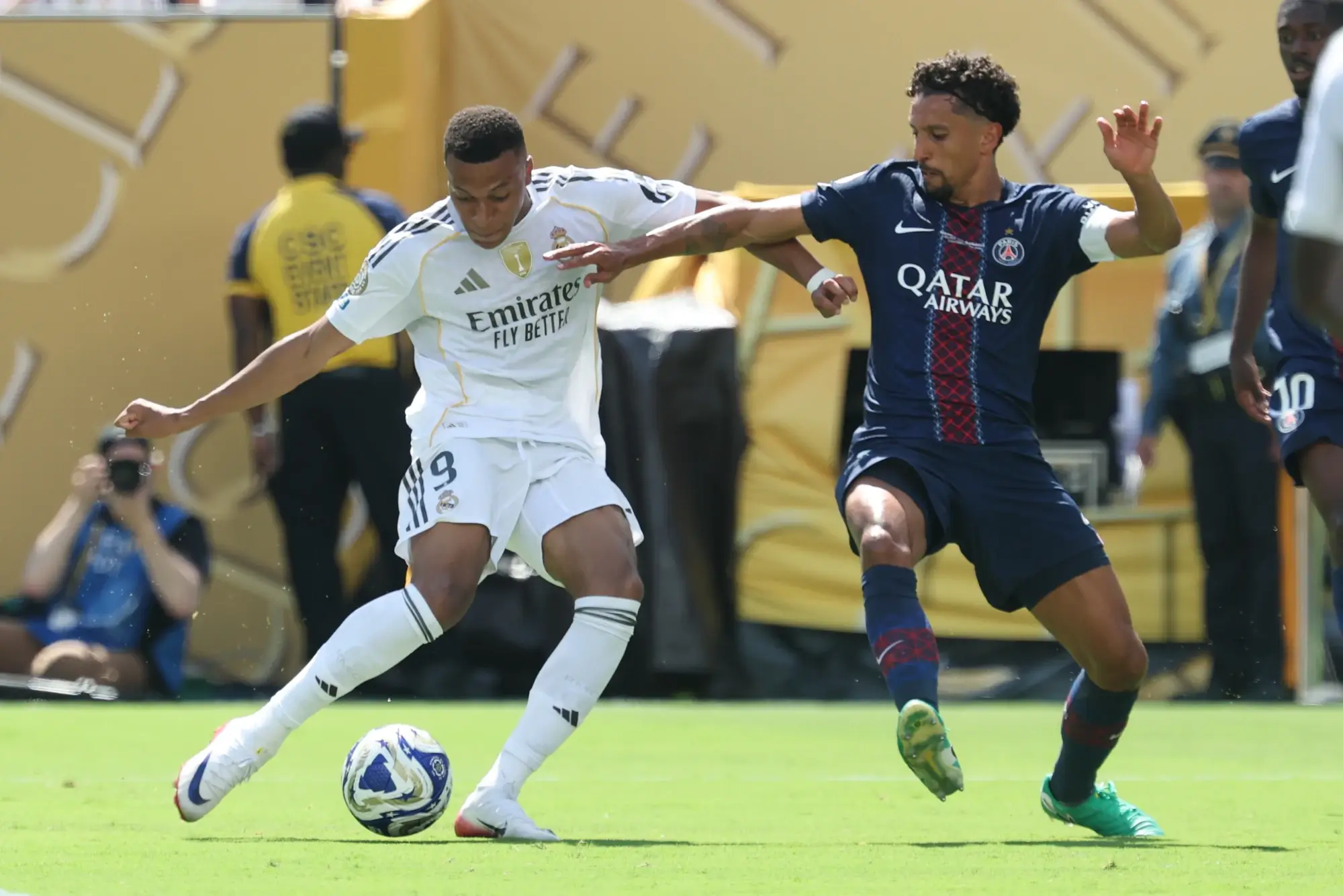 Jul 9, 2025; East Rutherford, New Jersey, USA; Real Madrid CF forward Kylian Mbappe (9) plays the ball against Paris Saint-Germain defender Marquinhos (5) during a semifinal match of the 2025 FIFA Club World Cup at MetLife Stadium.