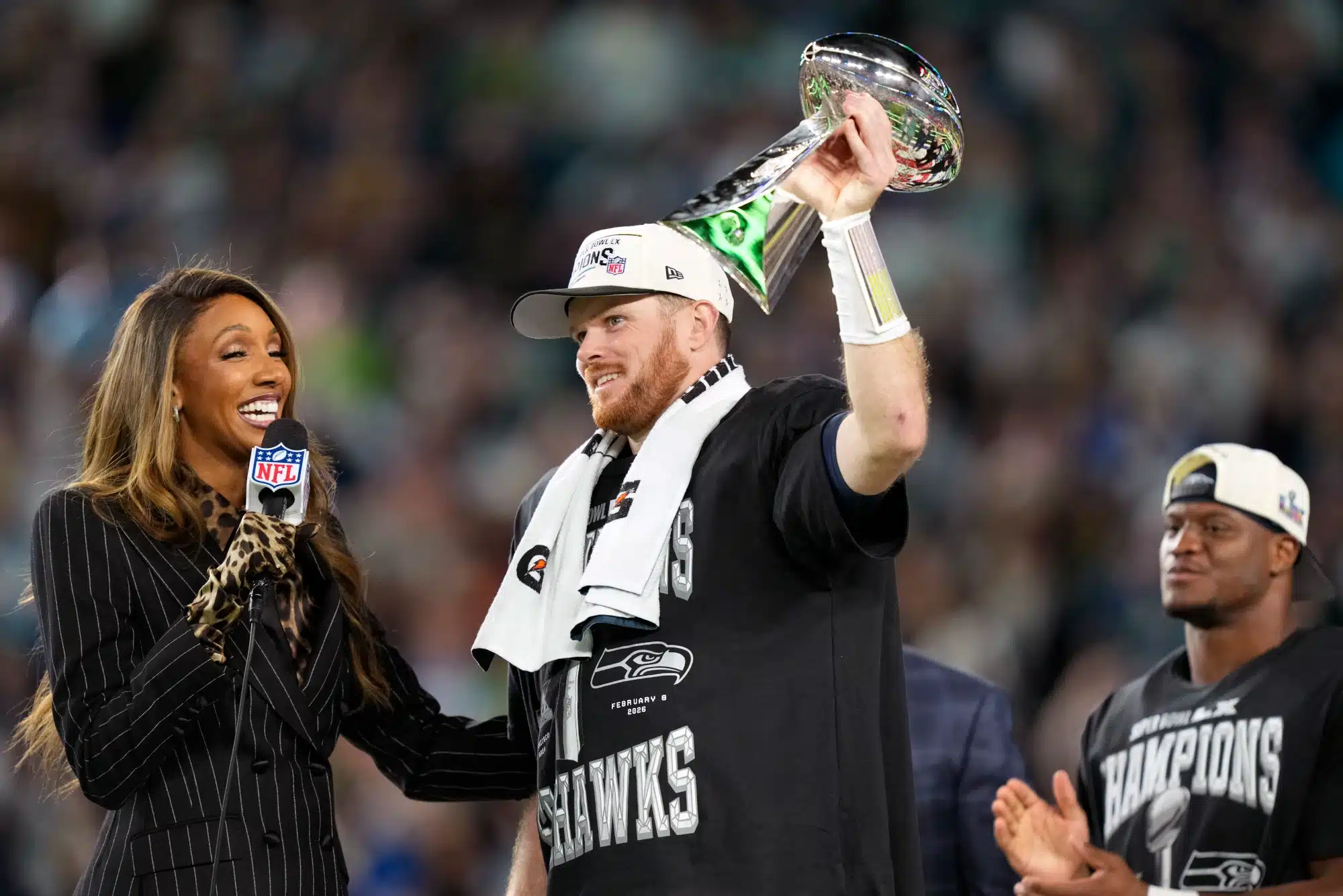 Feb 8, 2026; Santa Clara, CA, USA; Seattle Seahawks quarterback Sam Darnold (14) celebrates with the Vince Lombardi trophy after defeating the New England Patriots in Super Bowl LX at Levi's Stadium.
