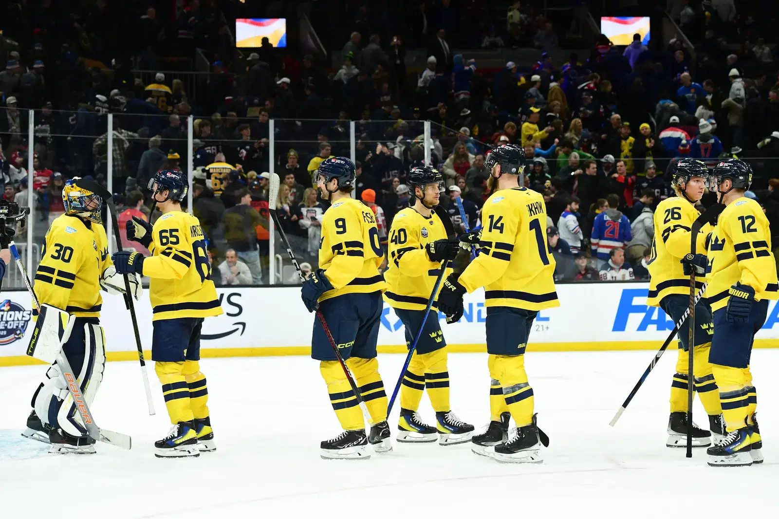 Team Sweden's men's hockey team shaking hand on the ice.