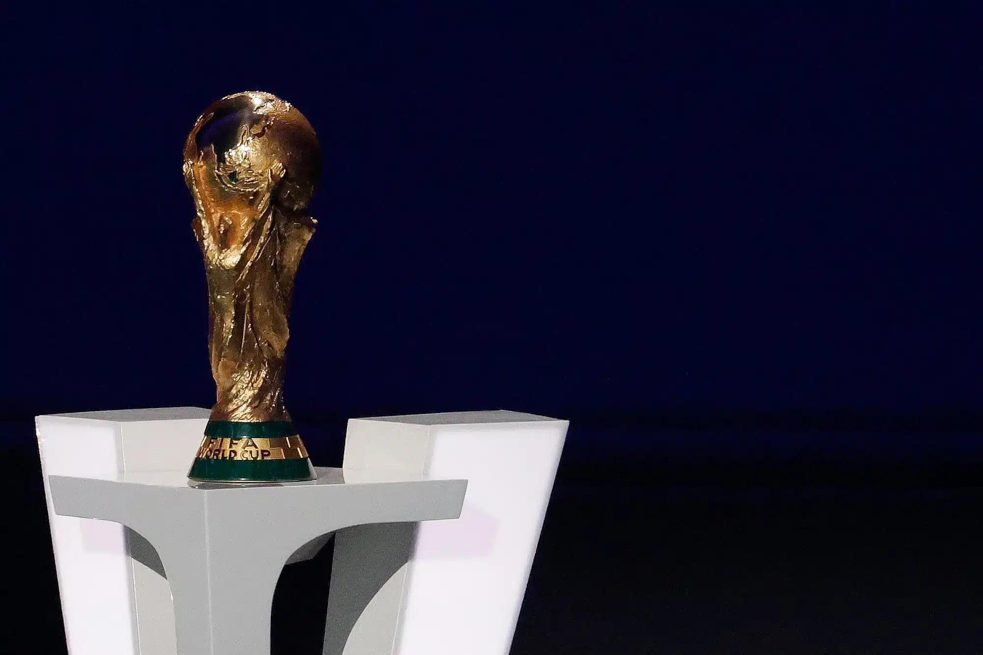 Dec 5, 2025; Washington, District of Columbia, USA; The World Cup trophy sits on a podium during the FIFA World Cup 2026 Final Draw at John F. Kennedy Center for the Performing Arts.