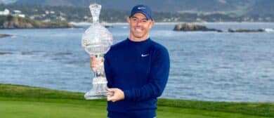 Rory McIlroy hoists the trophy during the final round of the AT&T Pebble Beach Pro-Am golf tournament at Pebble Beach Golf Links.