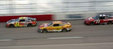 NASCAR Cup Series driver William Byron (24) leads driver Joey Logano (22) and driver Denny Hamlin (11) on a restart out of turn one during the Goodyear 400 at Darlington Raceway
